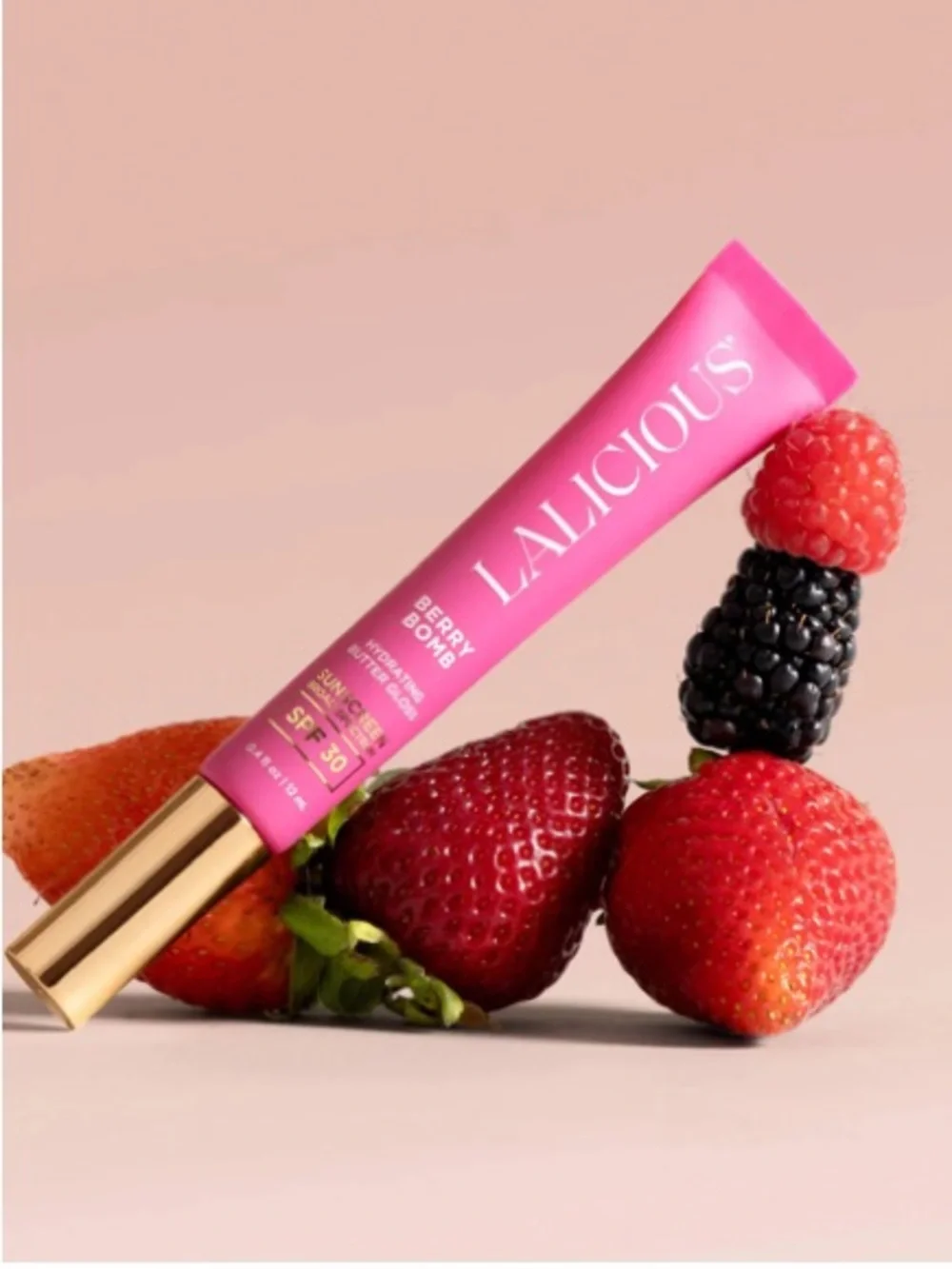 LALICIOUS Hydrating Butter Gloss SPF 30 in Berry Bomb shine shield plump hydrate
